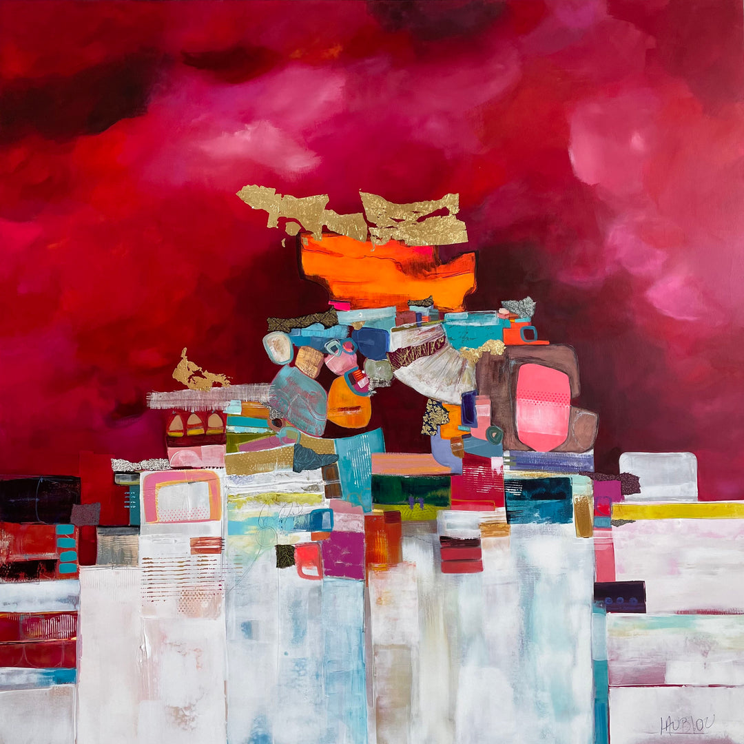 48" x 48" painting by Lau Blou, collaged pieces of torn and hand cut paper and fabrics with patterns and gold foil building up to triangular shape in middle of canvas on pink background with white on the bottom half