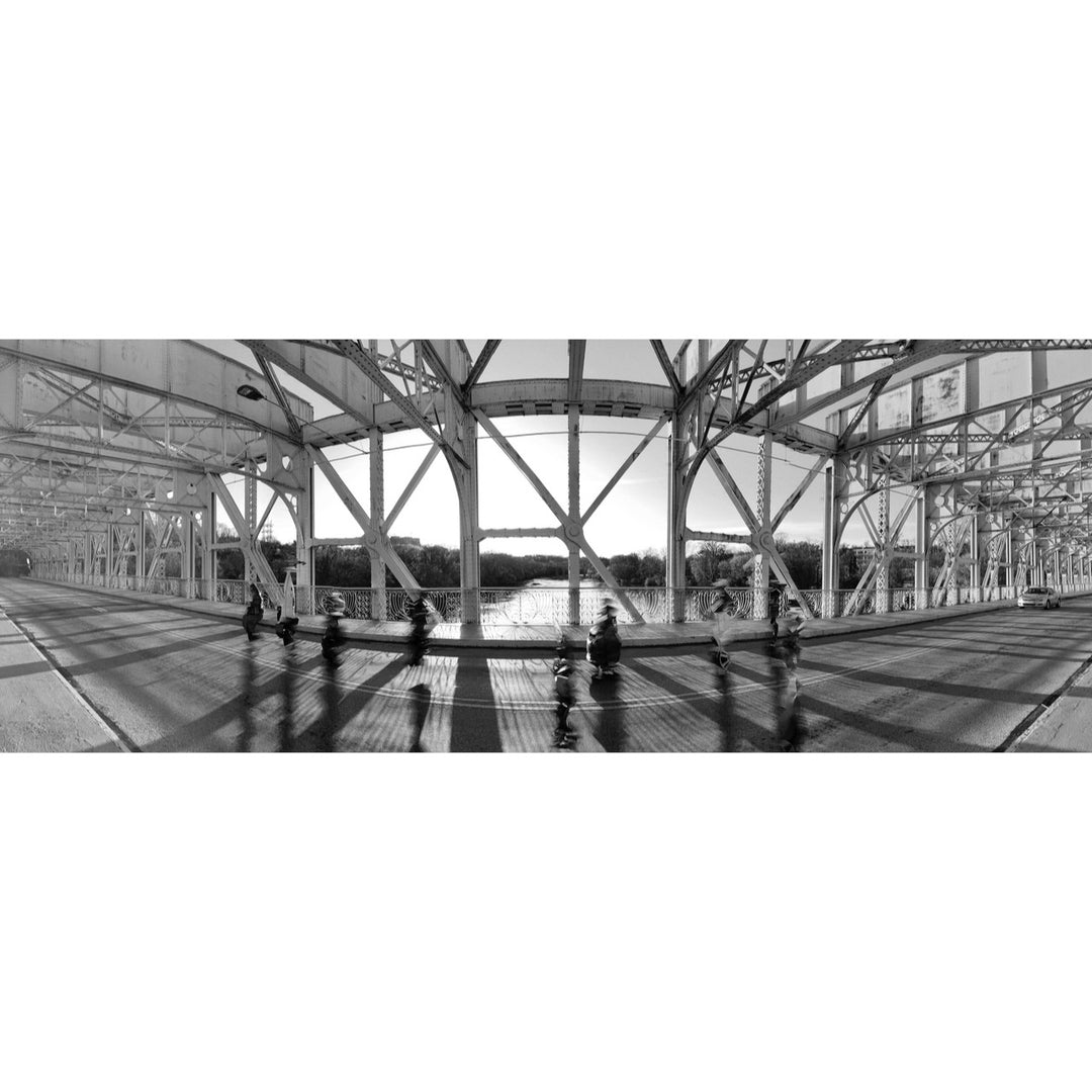 panorama photo in black and white of bridge with cars driving by, being cut off and abstracted by the panoramic quality
