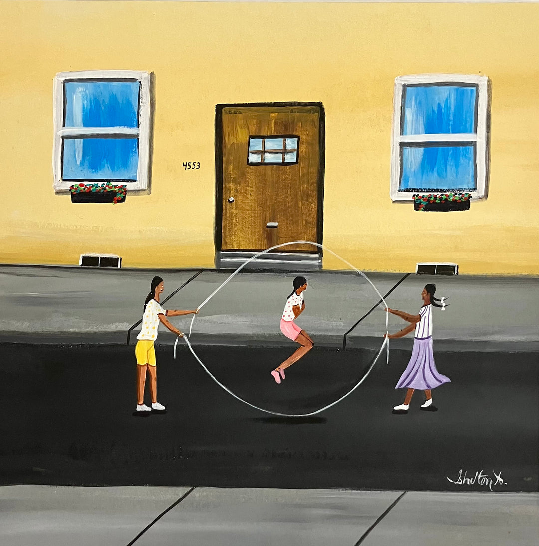 three girls playing jump rope double dutch outside in street in front of yellow house