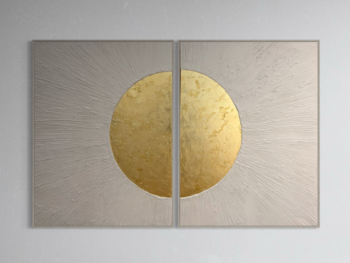 Beaming Duo by Lee in Cerulean. Textured diptych with white acrylic joint compound, lines emanating from center and beaming outwards with shiny gold circle in the middle