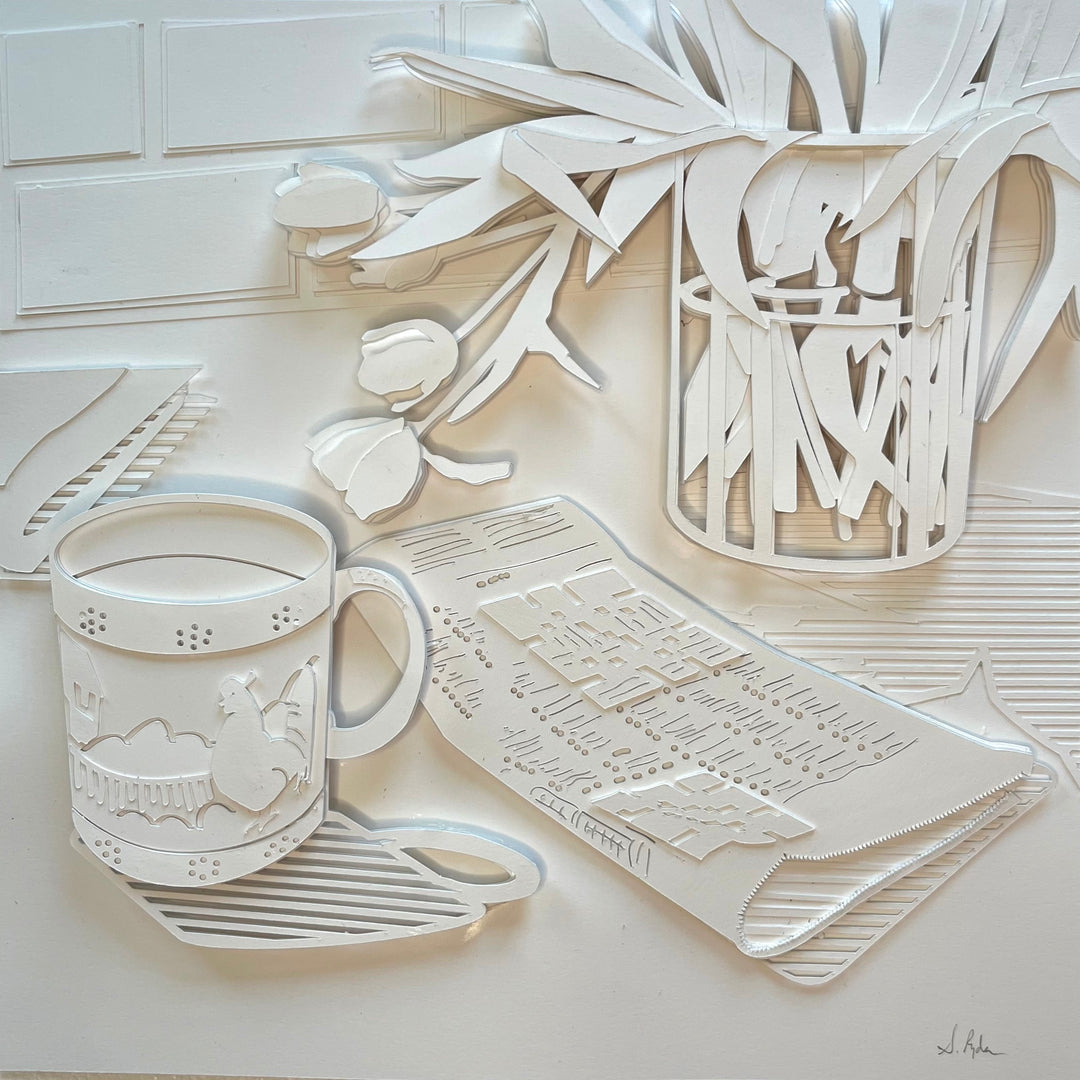 14"x14" paper cut collage featuring a coffee mug and crossword puzzle. 