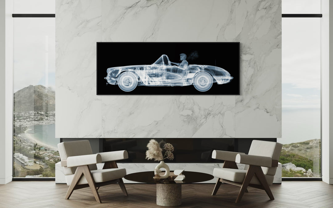 Framed Chromaluxe black and white x-ray photograph by Nick Veasey of a skelton man driving a vintage corvette cruiser while spoking a cigarette