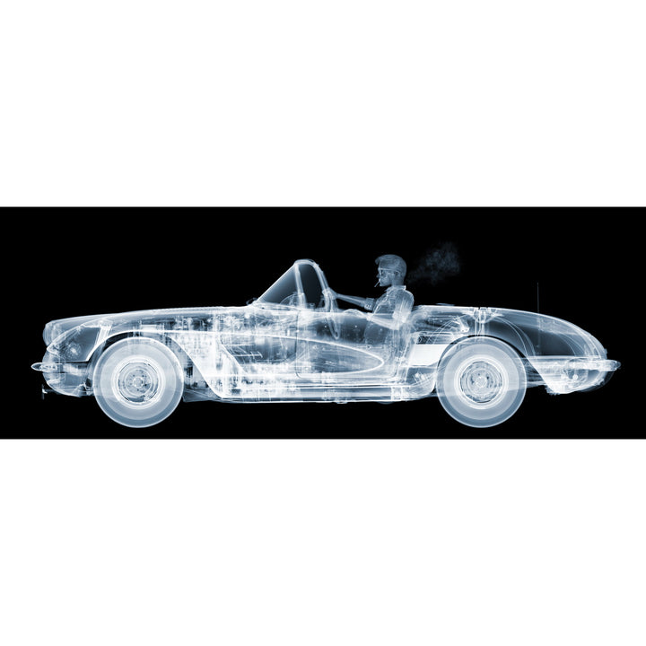 Framed Chromaluxe black and white x-ray photograph by Nick Veasey of a skelton man driving a vintage corvette cruiser while spoking a cigarette