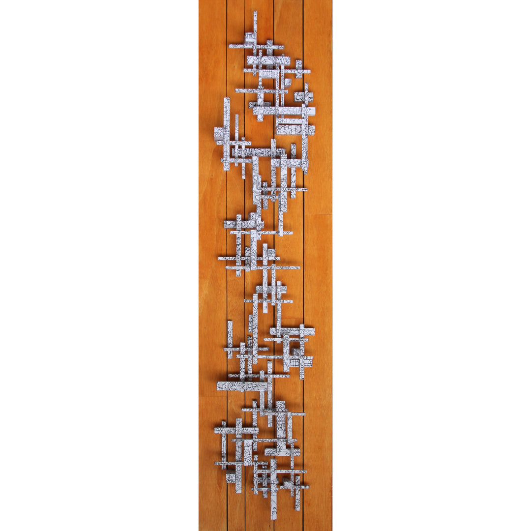 geometric assembly of detailed wood sticked arranged against hardwood floor bakground