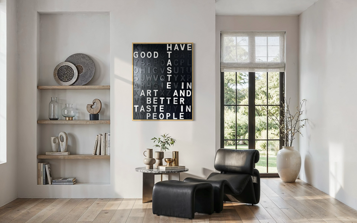 Steffanie Gerkin’s Have Good Taste Black 3D is a contemporary mixed-media typography artwork made with raised wood and acrylic letters on canvas, featuring a black monochrome alphabet grid with contrasting white letters that spell phrases including “Have Good Taste,” “Art,” “Better Taste,” and “People.”