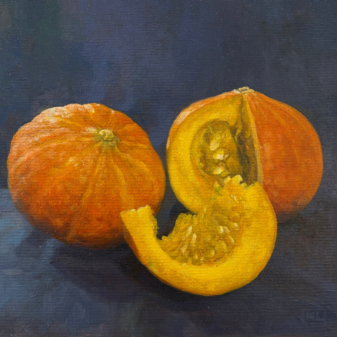 Oil still-life painting of photorealistic squash. Bright orange squash with a royal blue foreground
