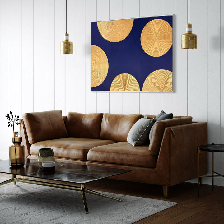 Indigo Awakening I by Lee In Cerulean. Acrylic painting of golden circles with smaller circles inside semi circles half off canvas on dark blue background.