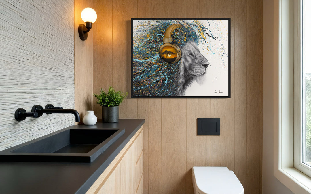 lion looking to the right in black and white face with splatter paint fur mane in blue gold and black wearing gold headphones with african desert sunset landscape on white background