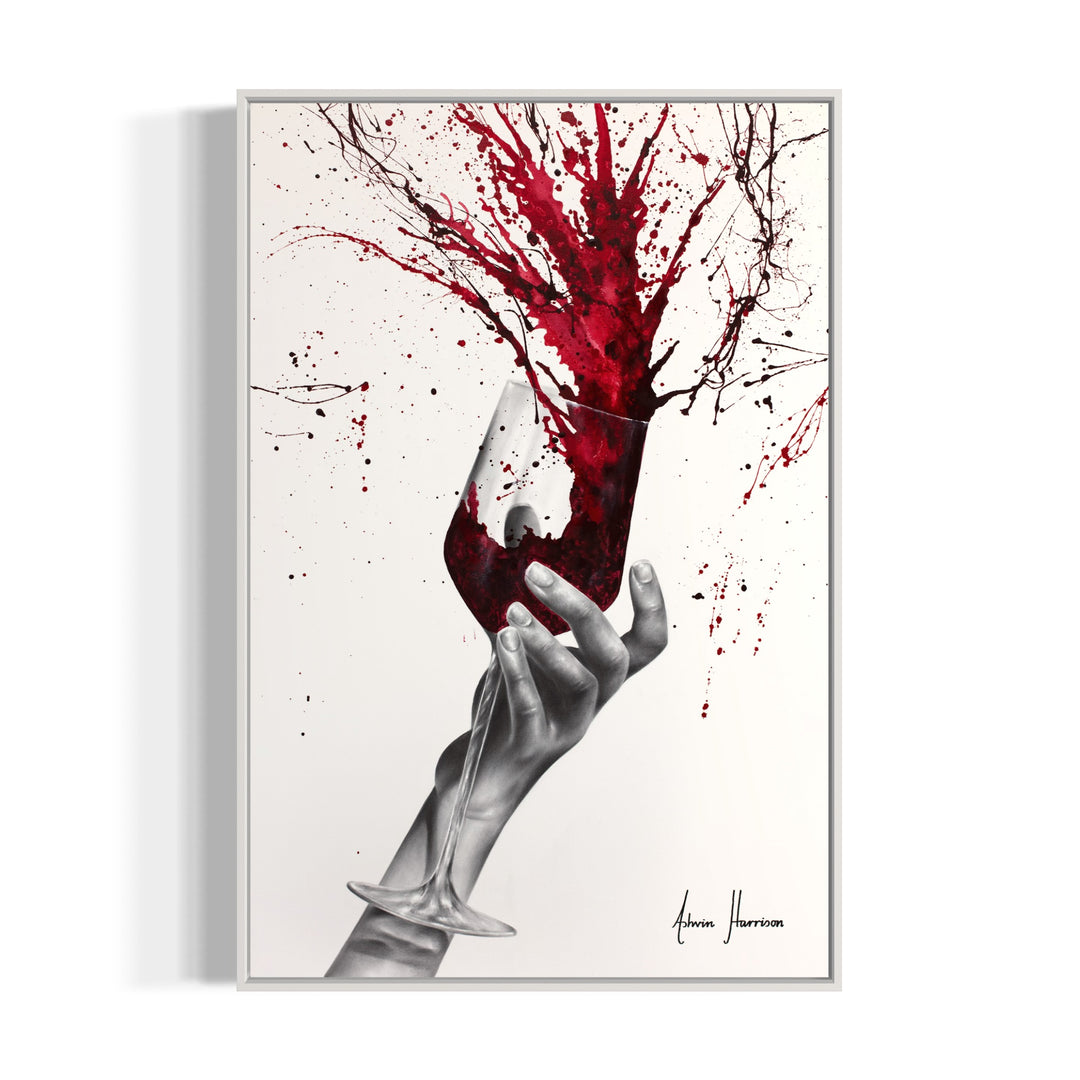 black and white hand holding wine glass red paint splattering out of glass onto background red paint splatter