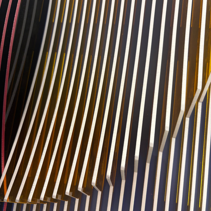 vertical stripes in purple white and navy with half convex concave sculptural circle shape coming out of center geometric abstract