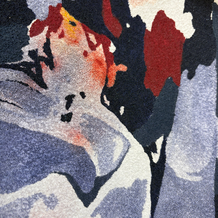 overabundance of lit flame candles taper sticks burning in blue red orange and yellow organic shapes negative space textured surface pumice and oil