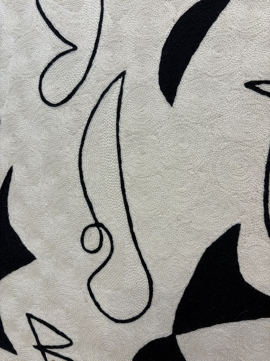 abstract shapes doodles line work in black and white negative space solid heavy chain stitched textile fabric embroidery