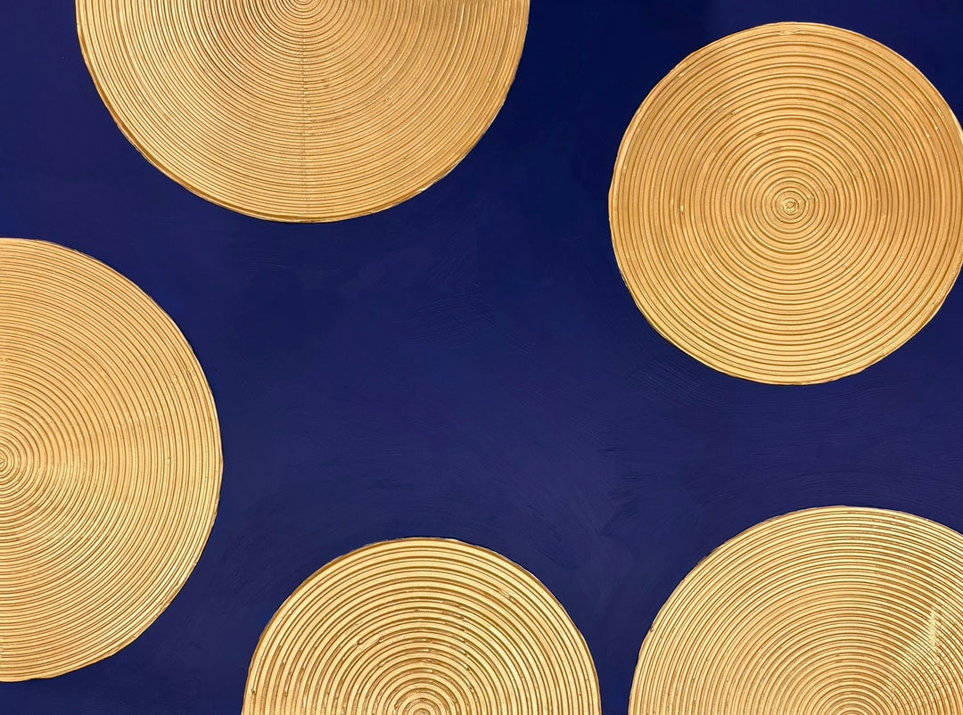 Indigo Awakening I by Lee In Cerulean. Acrylic painting of golden circles with smaller circles inside semi circles half off canvas on dark blue background.
