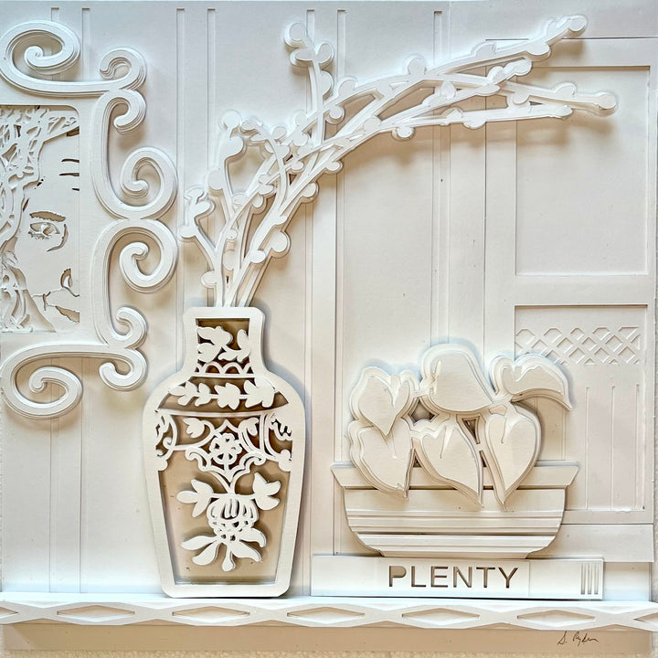 14"x14" layered white paper forming a vase with branches over a wall. 