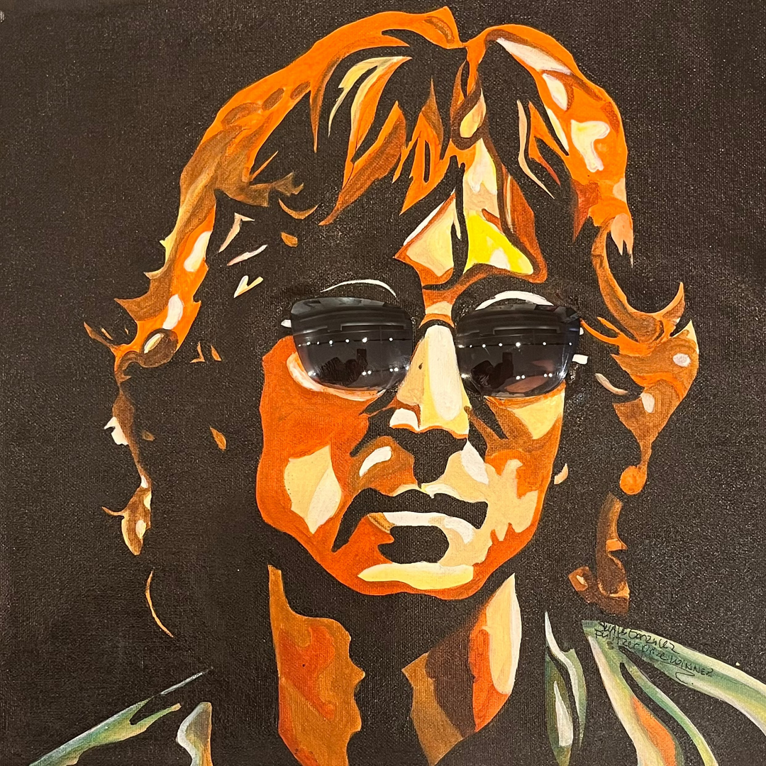"John Lennon Cool" by US-based artist Suave Gonzalez, an expressive acrylic on canvas portrait of iconic musician and Beatles legend John Lennon, depicted with his signature round dark sunglasses and tousled hair rendered in bold strokes of amber, orange, and brown against a deep black background. The dramatic use of light and shadow captures the timeless intensity and cultural legacy of one of rock and roll&