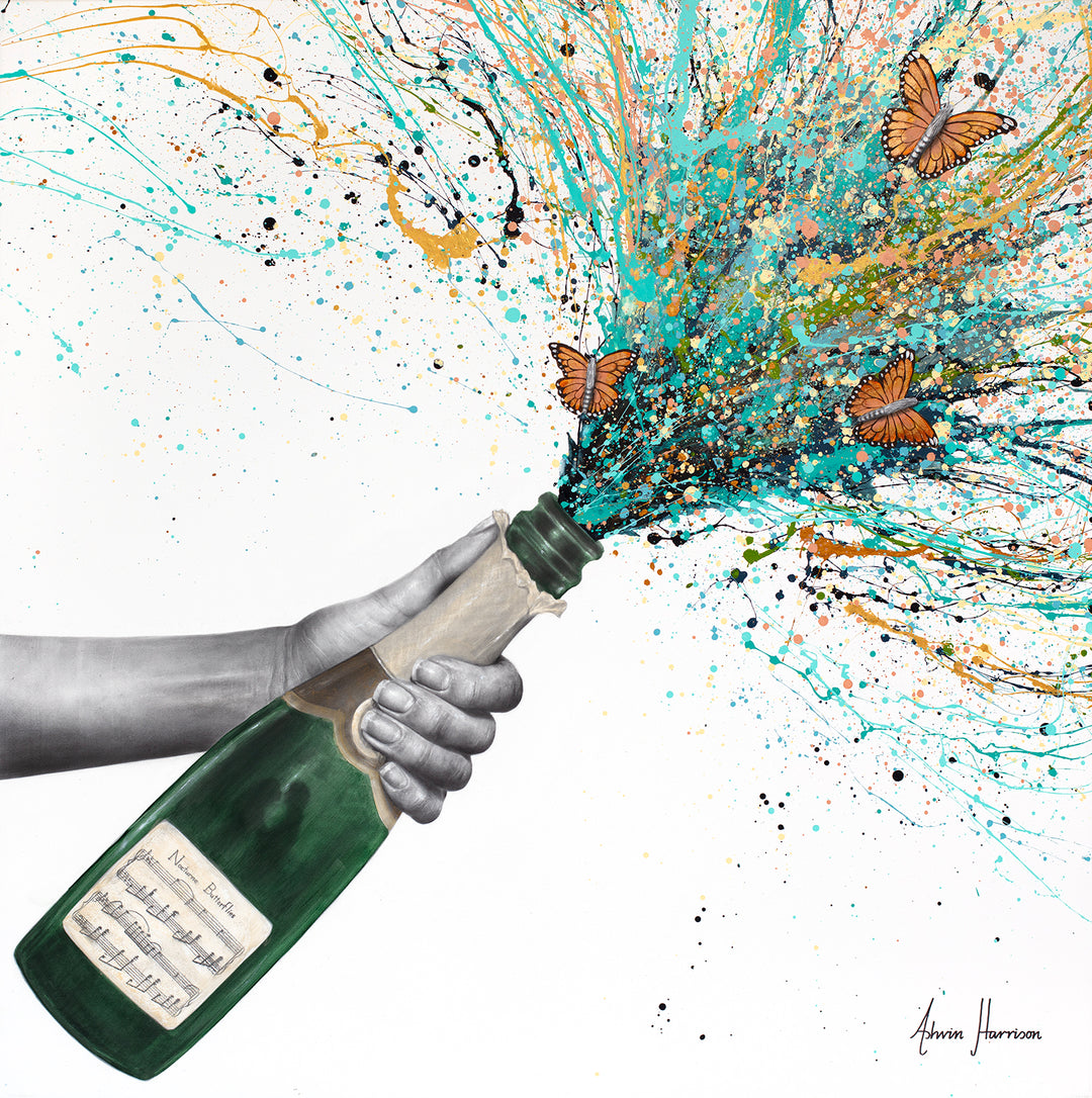 Ashvin Harrison, Nocturne Butterflies, coconut charcoal dust and acrylic on canvas, 36 x 36 inches. A grey charcoal-drawn arm and hand holding open a green champagne bottle with a label of handwritten sheet music, as a spray of turquoise, gold, peach and black paint splatters bursts from the neck carrying three orange monarch butterflies across a white background.