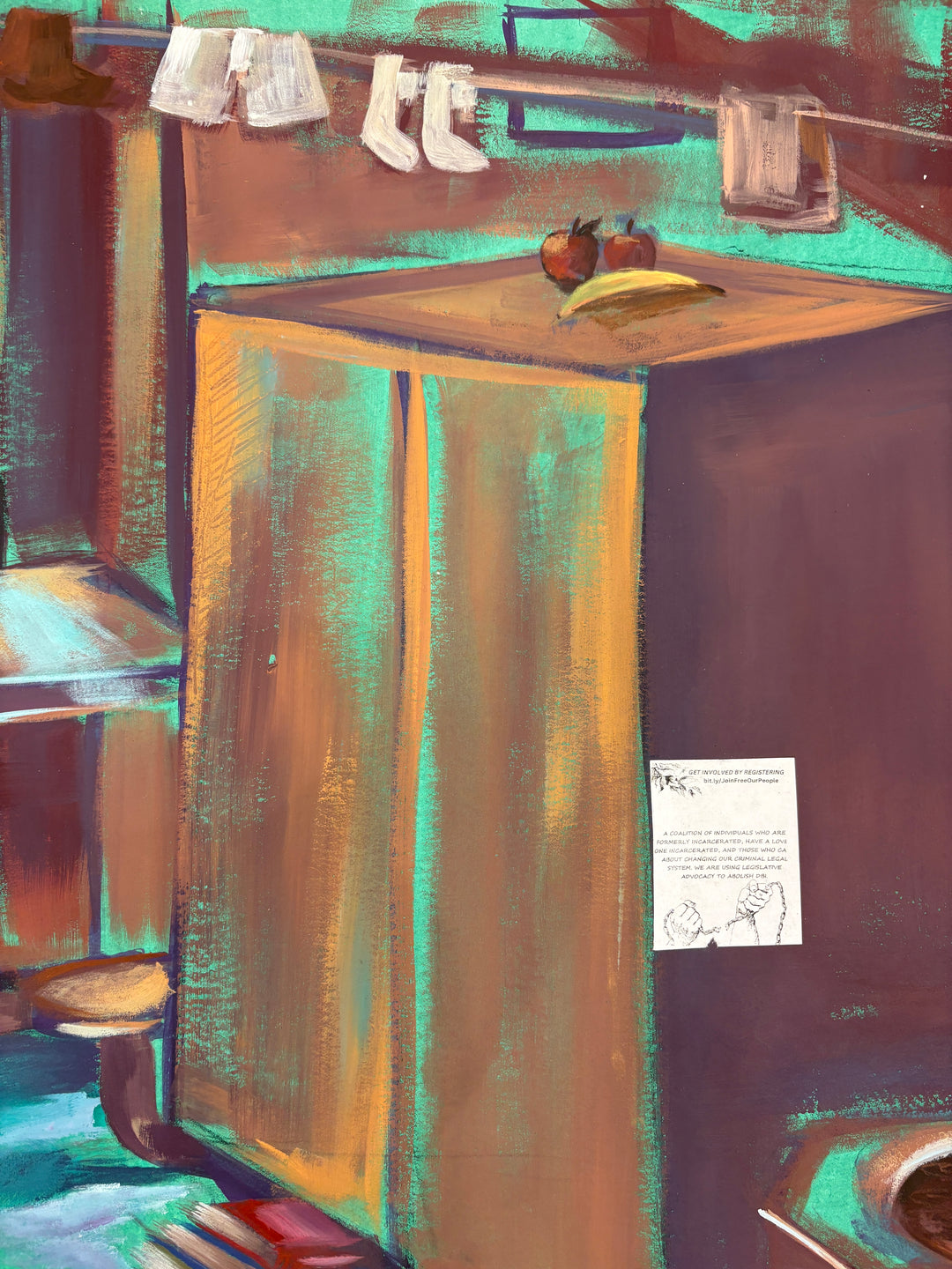 man sitting in prison cell with many belongings clothes toilet paper in blue an brown tones