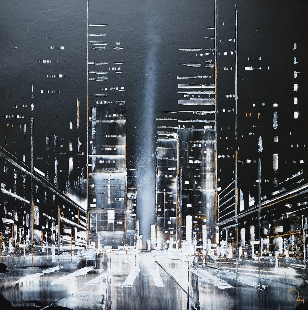 "Paradise" by French artist Julien Rey — a mixed-media painting on board of a dramatic nocturnal urban canyon, crafted with Chinese lacquer and gold leaf. Towering skyscrapers in deep black lacquer and silver flank a rain-soaked street, its wet surface reflecting a luminous central searchlight beam piercing the night sky. Sparse gold leaf accents flicker across building facades. Original contemporary nocturnal cityscape painting on board available at Morton Contemporary gallery.