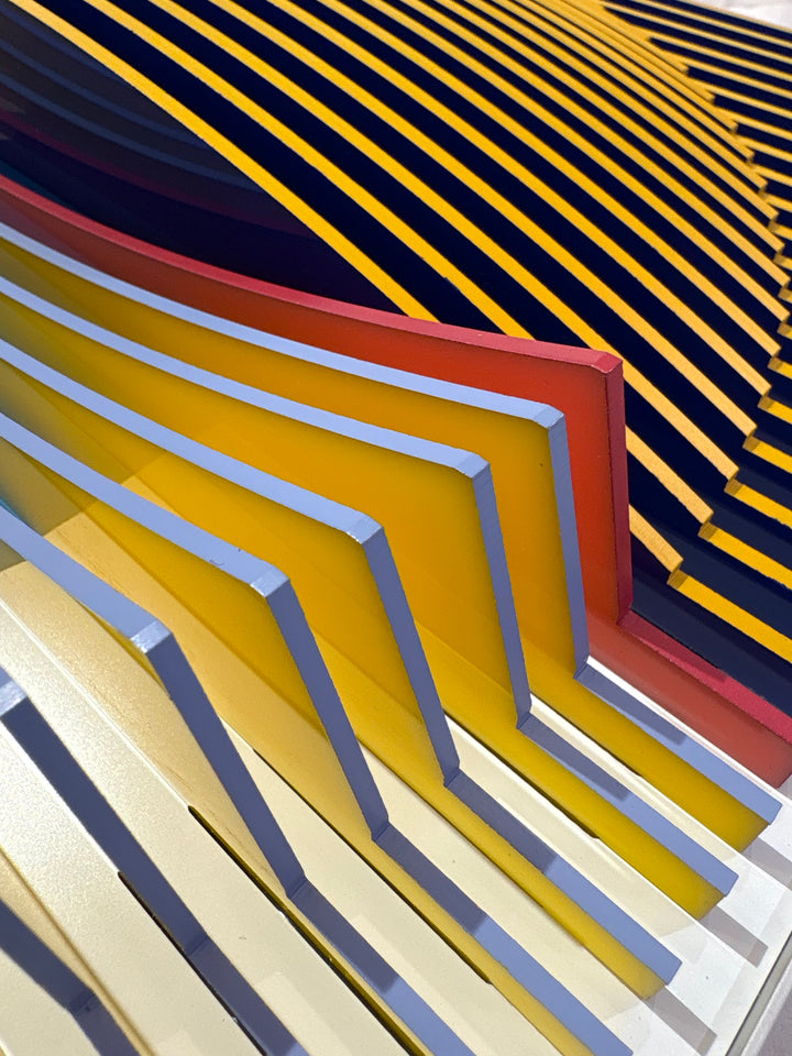 Porthole 440 by José Margulis – curved edge detail of the golden yellow and red plexiglass strip layers