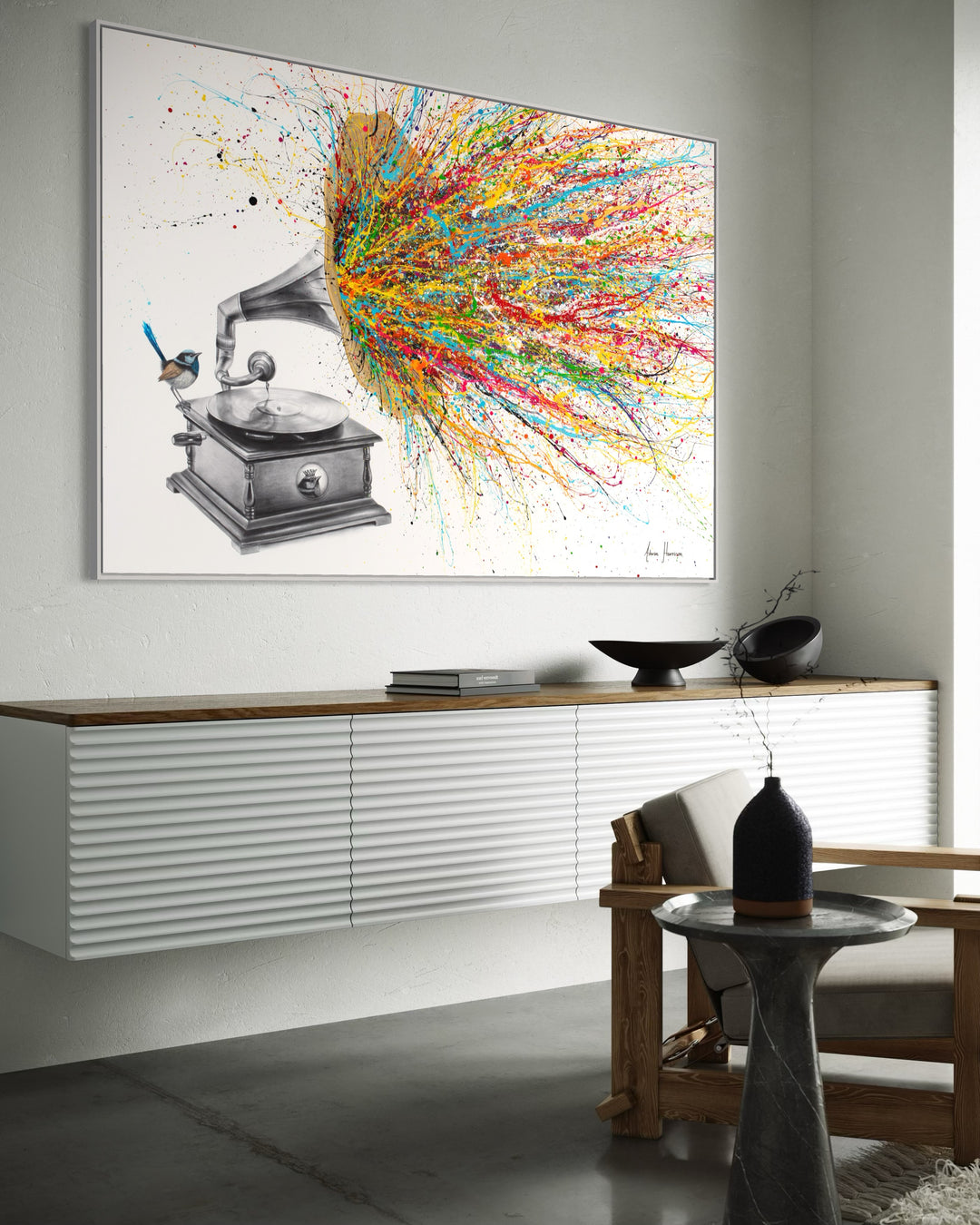 large gramophone music player with record vinyl and wren blue bird sitting on it with big gold speaker and rainbow paint splatters coimng out on white background