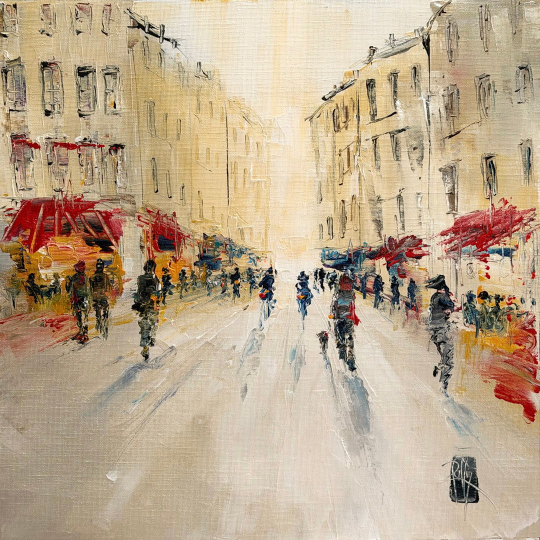 Christian Raffin, Rue Animée, oil on canvas, 14 x 14 inches. A busy street between cream buildings with red awnings, with crowds of small figures and cyclists moving down a pale road.