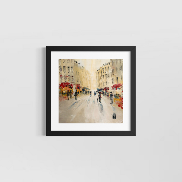Christian Raffin, Rue Animée, oil on canvas, 14 x 14 inches, shown in a black frame with a white mat hanging on a light grey wall.