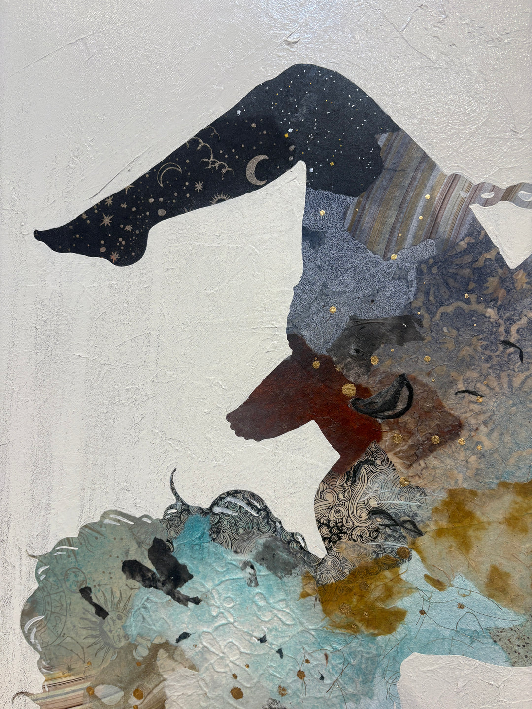 "Swinging Silhouettes" by Christopher Peter — a mixed-media collage painting on canvas depicting two women swinging on chains, their figures filled with layered botanical textures, celestial-patterned legwear, teal washes, gold accents, and floral patterns against a soft plaster-textured ivory background. A joyful, dreamlike celebration of freedom and feminine energy. Original contemporary mixed-media figurative collage painting on canvas available at Morton Contemporary gallery.