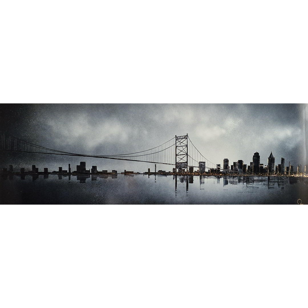 Julien Rey, Skyline, lacquer and gold leaf on board, 16 x 47 inches. Panoramic monochrome cityscape with a suspension bridge and city skyline reflected across still water, with warm amber lights along the waterline.