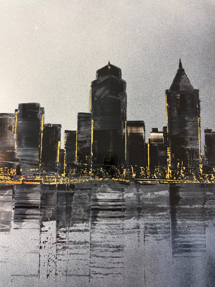 Julien Rey, Skyline, lacquer and gold leaf on board, 16 × 47 inches. Close-up detail of dark lacquered skyscrapers with gold leaf window lights reflected in the water below.
