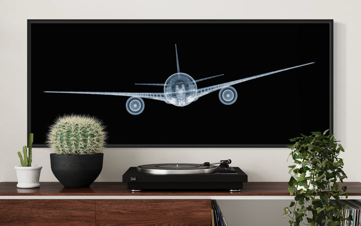 Framed Chromaluxe x-ray photograph by Nick Veasey of a mechanical jet on black background
