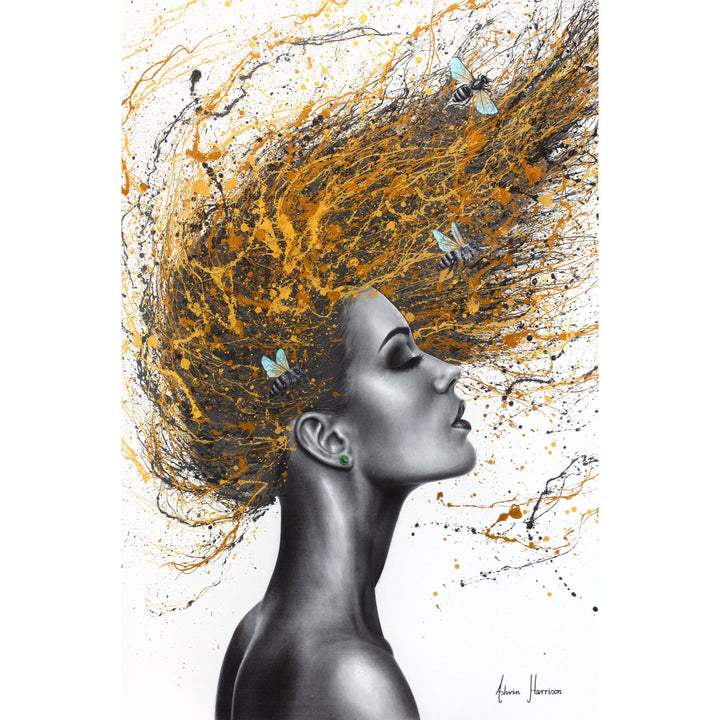 Profile of a woman painted in coconut charcoal, flipping her hair, splattered gold and orange paint with honey bees