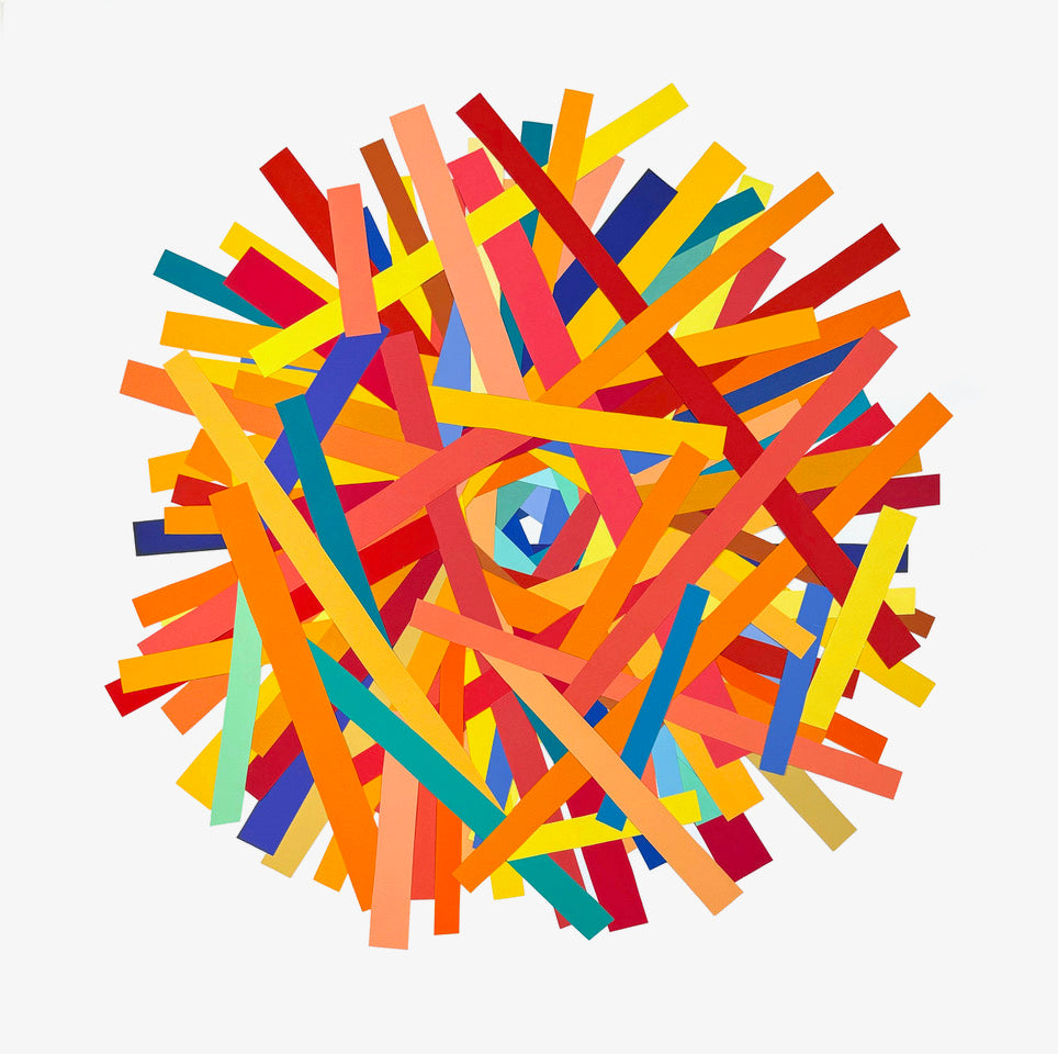 Abstract collage emulating a kaleidoscope in hues to red, orange and yellow