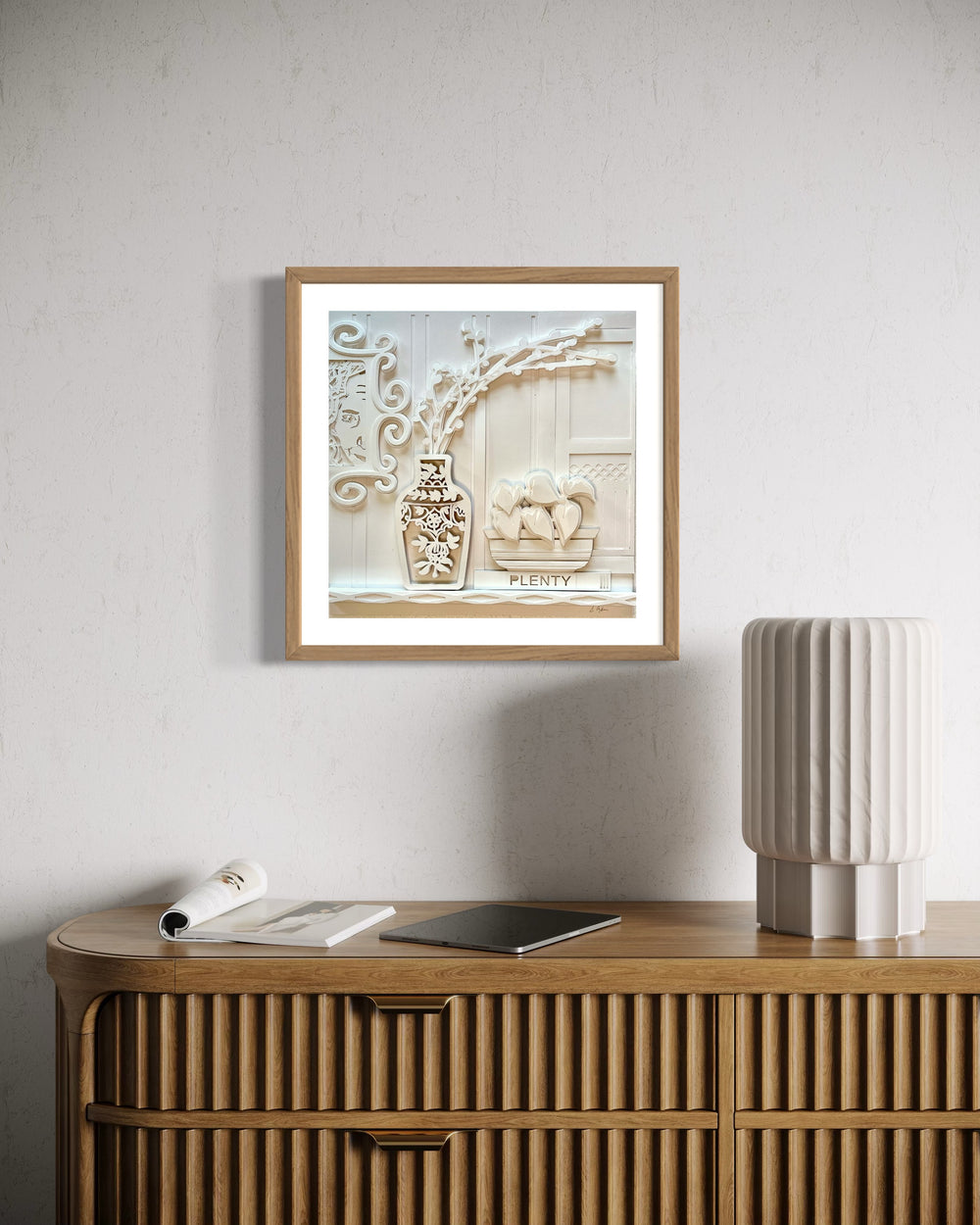 14"x14" layered white paper forming a vase with branches over a wall. 