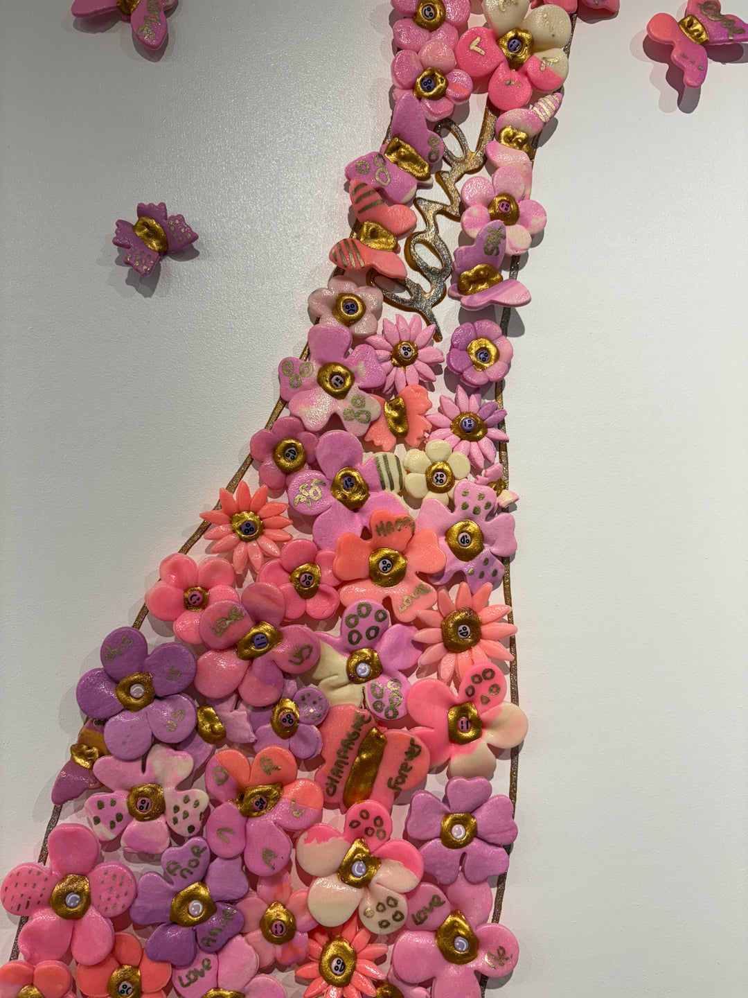 Acrylic clay and modeling paste painting of bottle champagne of pink 3 dimensional flowers coming out of bottle to butterflies on white canvas