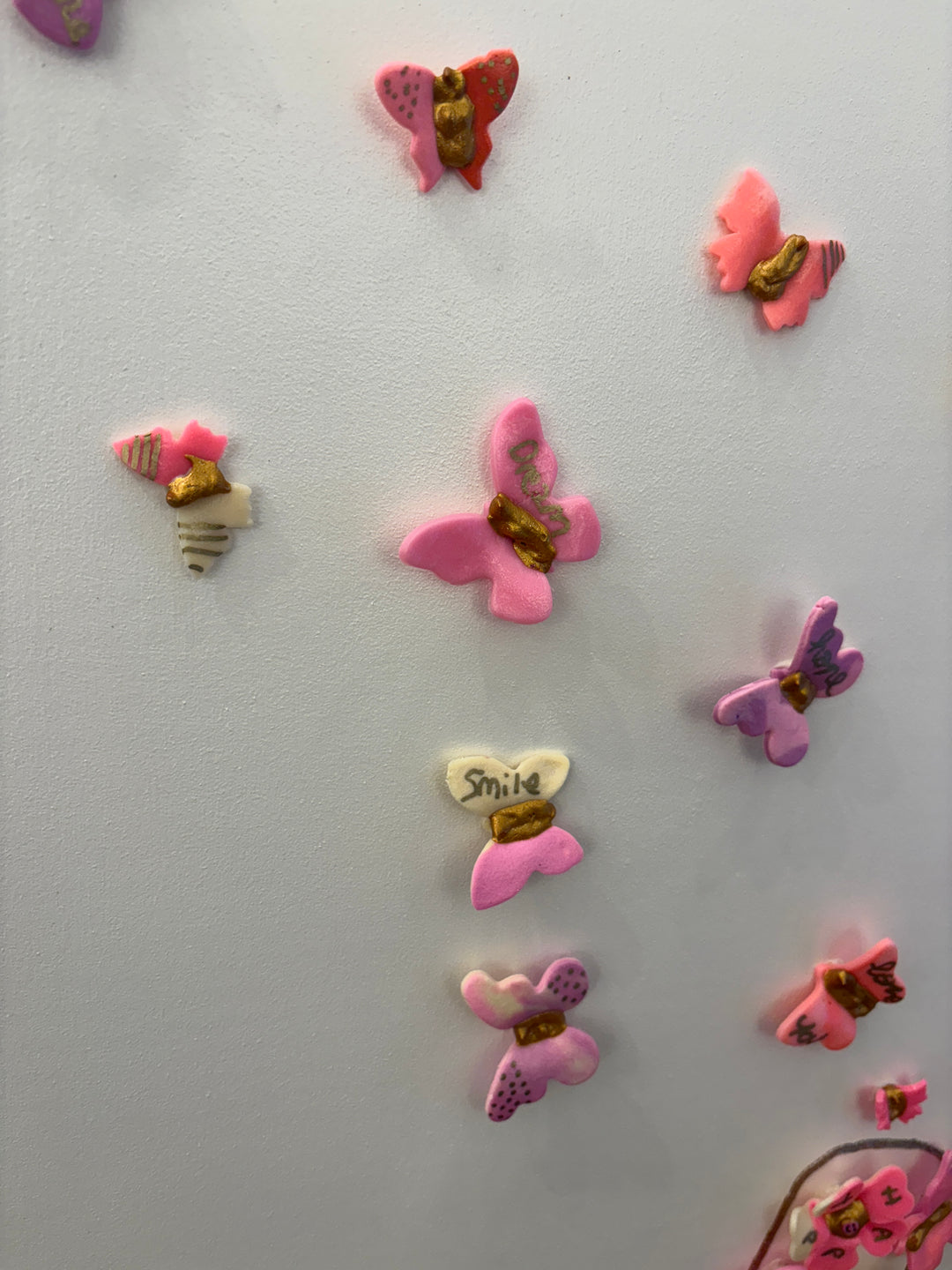 Acrylic clay and modeling paste painting of bottle champagne of pink 3 dimensional flowers coming out of bottle to butterflies on white canvas