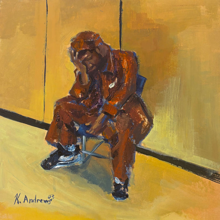 brown orange figure in despair leaning against knees sitting in chair in yellow room