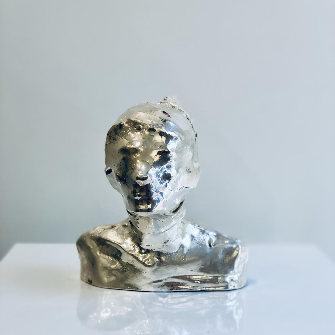 Untitled, artwork by Michal Cimala. Galvanized silver with polyurethane. 4.75 by 4.75 by 2.5 inches.