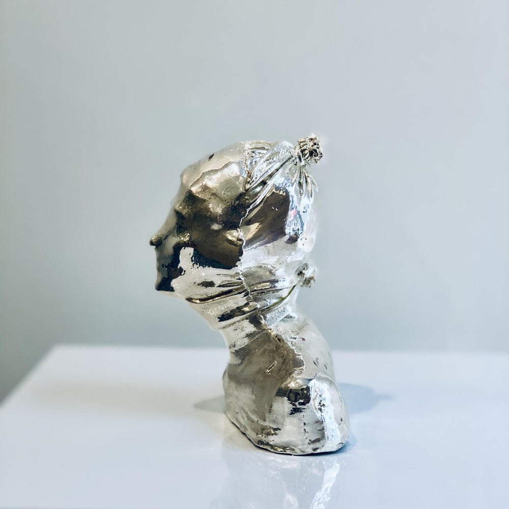 Untitled, artwork by Michal Cimala. Galvanized silver with polyurethane. 4.75 by 4.75 by 2.5 inches.