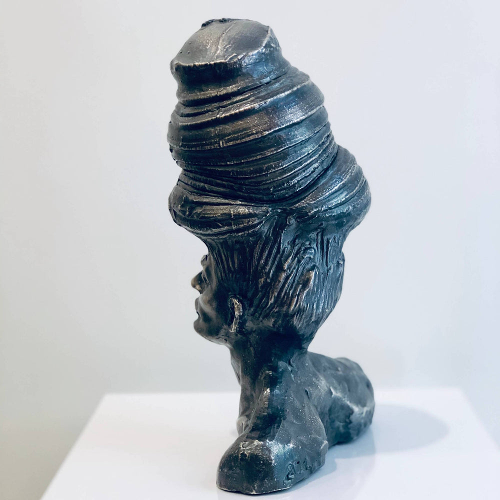 Shit On The Top, sculpture by Michal Cimala. Galvanized silver with polyurethane. 8 by 4.75 by 4.75 inches.