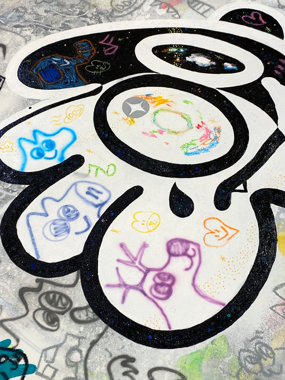 Detail of Yusuke Toda - YUM in Wonderland, black and white, multicolor contemporary painting. Acrylic and oil stick on 35.4" x 35.4" canvas